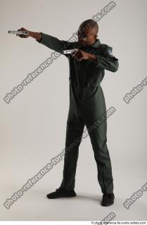 02 2018 01 ERIC STANDING POSE WITH GUNS